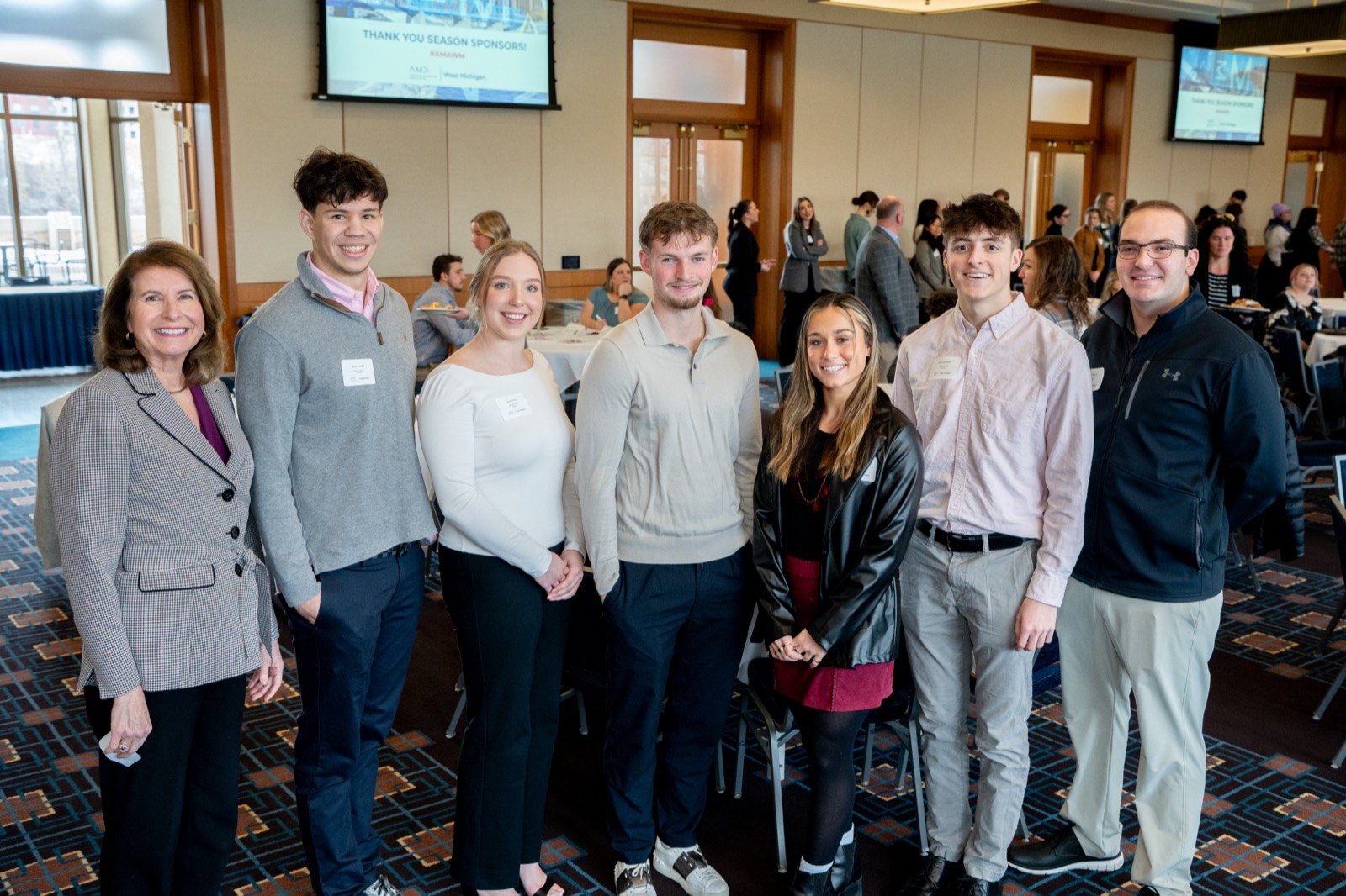 A group of students and mentors posing together at the student networking event